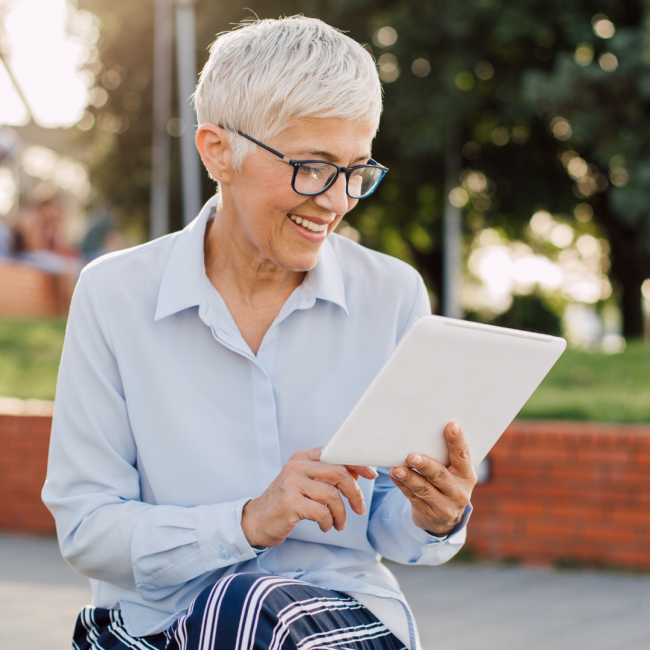 older woman on a tablet
