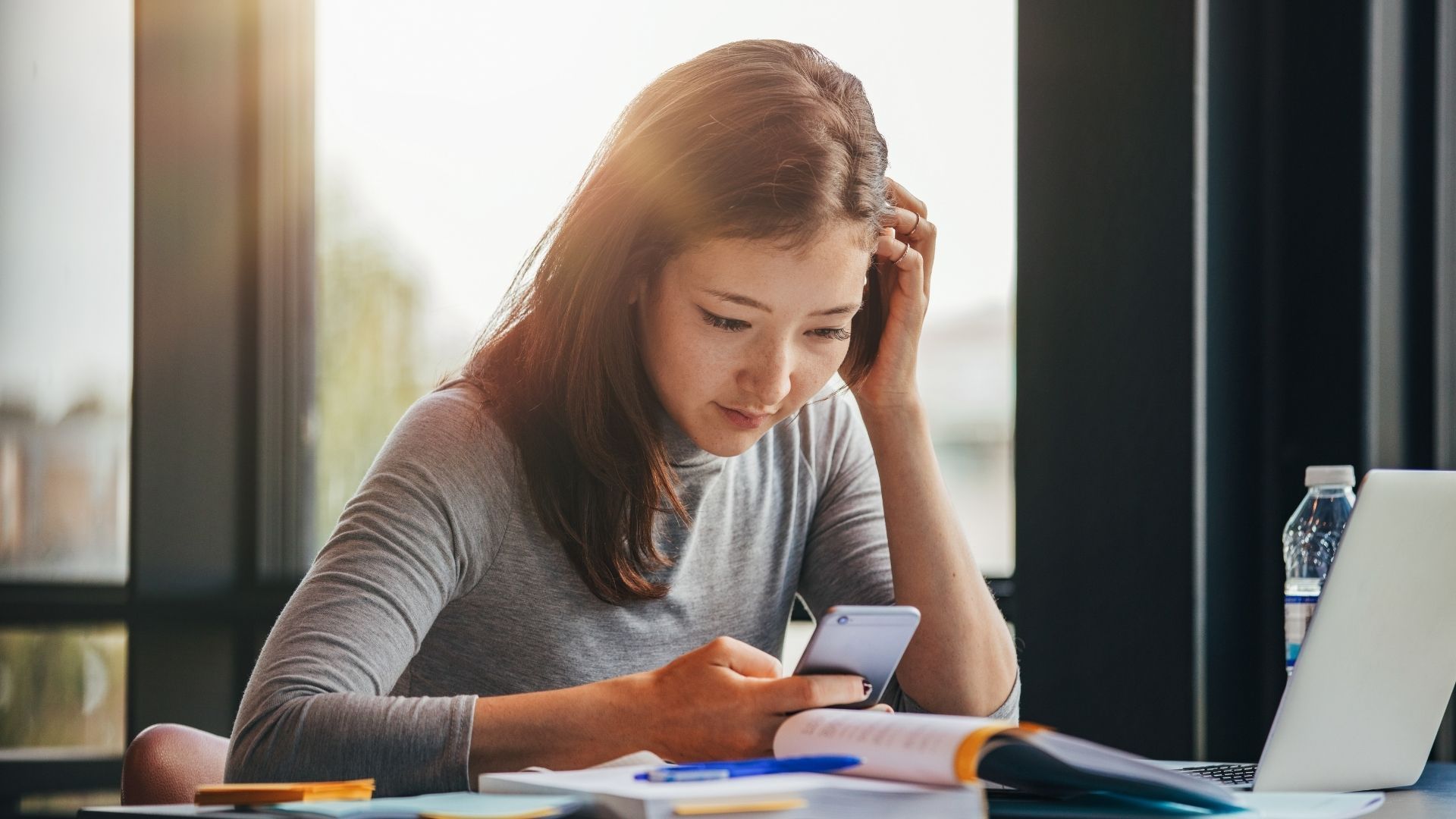 woman looking at phone