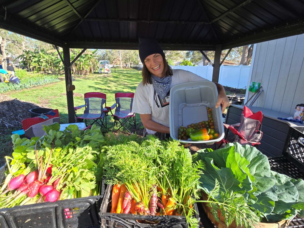A woman poses with the harvest.