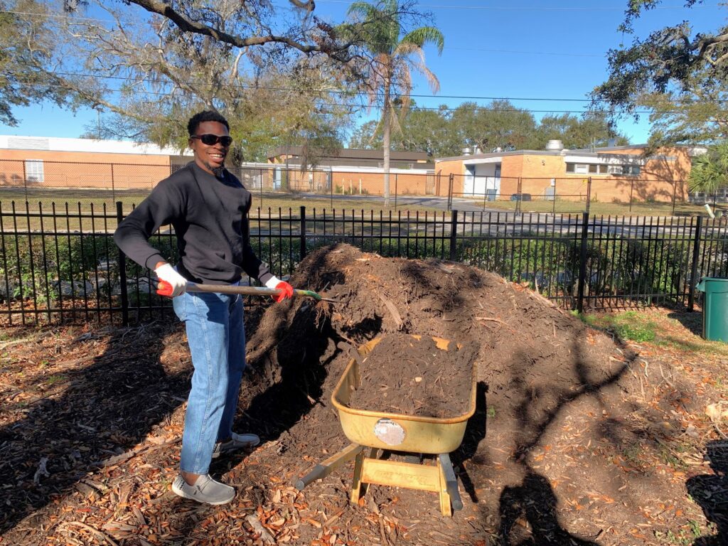 Man filling up wheelbarrow