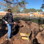 Man filling up wheelbarrow