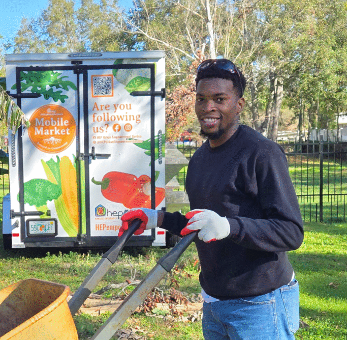 Man pushing a wheelbarrow
