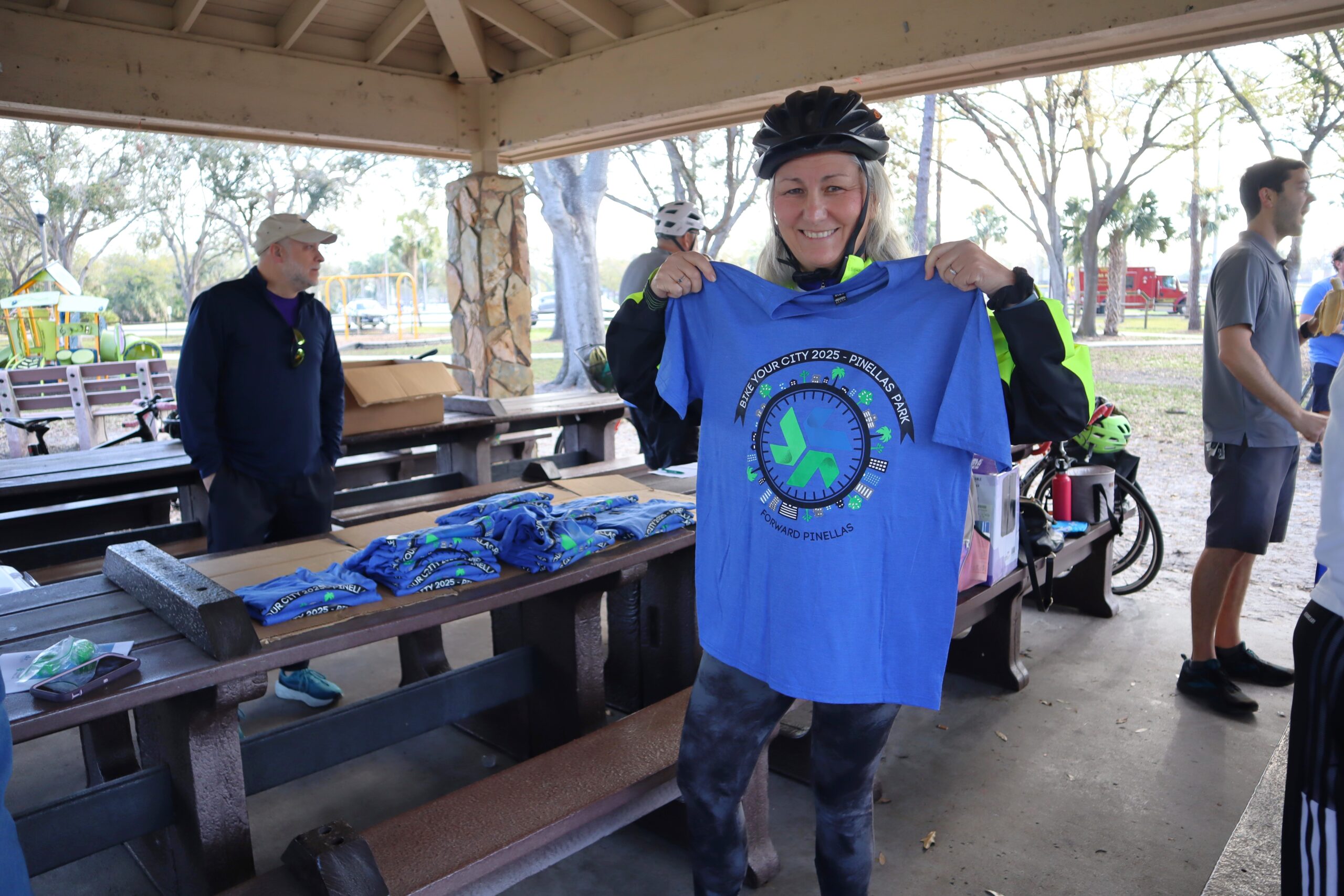woman holding up shirt