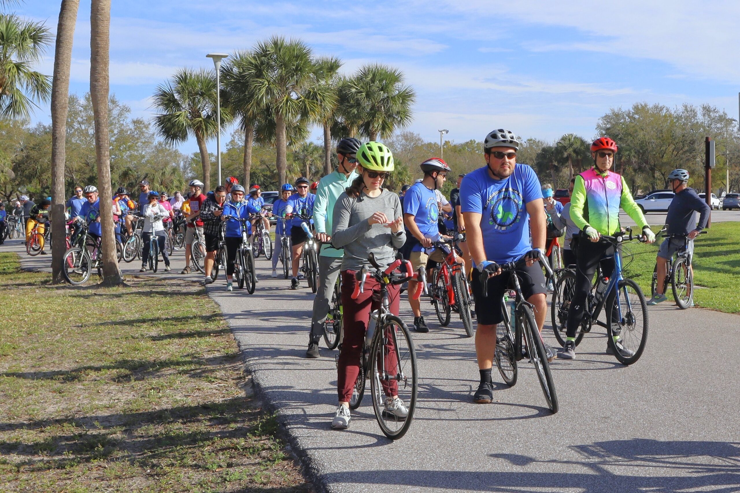 group of people lined up on bikes
