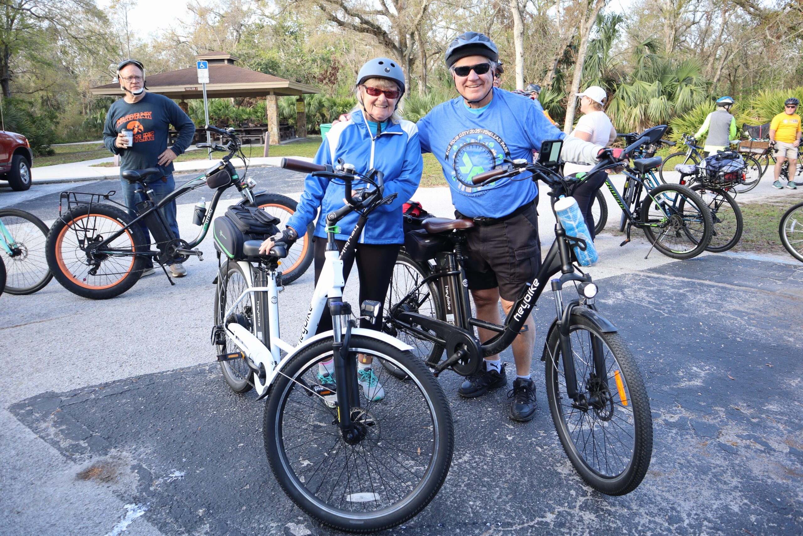 man and woman with bikes