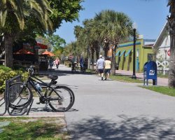 Walkers traverse the trail through downtown Dunedin.